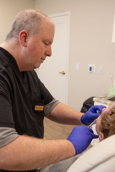 Dr. Brewer injecting a patient in Bloomington, IL